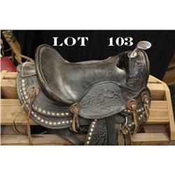 Fancy child’s tooled leather saddle in  overall good condition with wooden stirrups  and leather tra