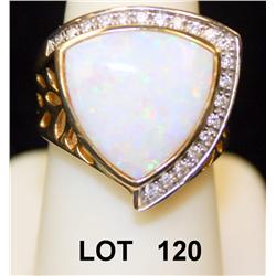Opal and diamond ring, set in 14kt yellow  gold. Dealer’s tag still attached. Retail:  $2,475. Good 