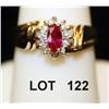 Image 1 : Marquis cut ruby ring surrounded by diamonds,  mounted in diminutive 10kt gold setting. A  beautiful