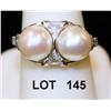 Image 1 : Two large pearls, beautifully  mounted in  platinum with fancy triangle and oval  accents. An outsta