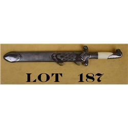 German Parade knife and metal sheath approx.  15” overall with an approx. 10” blade that is  etched 