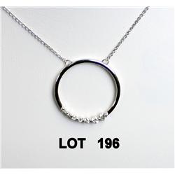 Circular pendant set with 7 diamonds in  ascending order weighing .33ct with a link  chain in 14kt w