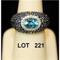 Ladies ring showing diamonds, sapphire, and  oval blue topaz on 14kt white gold. Est:  $2,500 - $4,0
