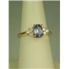 Image 1 : Splendid 14 karat yellow gold ladies ring set  with a center oval cut Tanzanite weighing  approx. 1.