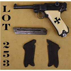 German Luger semi-auto pistol, nazi proofed,  9mm cal., 4” barrel, military black finish,  ivory gri