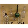 Image 1 : Collectible lot of seven back bar bottles  including a scalloped bottle marked in white  enamel “Bla