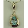 Image 1 : Splendid 14 karat yellow gold ladies custom  made pendant set with a center pear shape  blue/green A