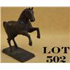 Image 1 : Iron rearing horse bank on stand approx. 8”  high with a dark patina and some traces of  what appear