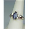 Image 2 : Stylish 14 karat yellow gold ladies ring set  with a center MQ cut Ceylon type color  sapphire weigh