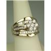 Image 2 : Stunning 14 karat yellow gold ladies custom  made ring channel set with a combination of  round, pri