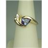 Image 1 : Superb 14 karat yellow gold ladies custom  made ring set with a fine center pear shape  Tanzanite we