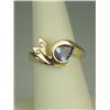 Image 2 : Superb 14 karat yellow gold ladies custom  made ring set with a fine center pear shape  Tanzanite we