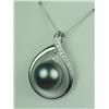 Image 2 : Marvelous 14 karat white gold ladies custom  made pendant set with a center fine round  black pearl 