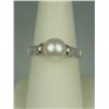 Image 1 : Fashionable 10 karat white gold ladies ring  set with a center round pearl averaging 8.00  mm in dia
