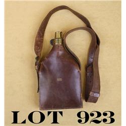 Large leather flask bag approx. 10” x 5-1/2”  with leather strap and brass charging spout  marked “C