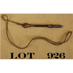 Old brass capper tool, approx. 5” overall   with brass ring at top and old hanging cord  in overall 