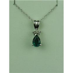 Pleasant 14 karat white gold ladies pendant  set with a pear shape Chatham created emerald  weighing