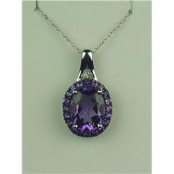 Vibrant 10 karat white gold ladies pendant  set with a center Amethyst weighing approx.  3.00 carats