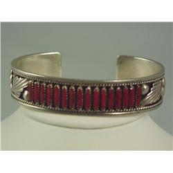 Very finely crafted and handmade ladies  sterling silver bangle with red coral inlays  and signed by