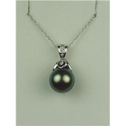 Wonderful 14 karat white gold ladies pendant  set with a center black pearl averaging 8.50  mm in di