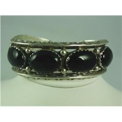 Very finely carved ladies sterling silver  bangle bracelet bezel set with 5 large oval  black Jade. 