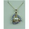 Image 1 : Charming 14 karat yellow gold ladies custom  made pendant set with a center round pearl  averaging 7