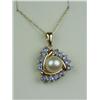 Image 2 : Charming 14 karat yellow gold ladies custom  made pendant set with a center round pearl  averaging 7
