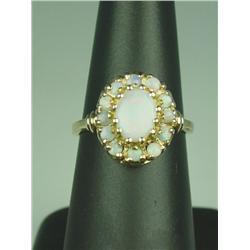 Pleasant 10 karat yellow gold ladies ring set  with nice Australian opal weighing approx.  2.00 cara