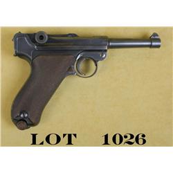 German Luger semi-auto pistol by DWM, 9mm  cal., 4” barrel, muted black finish,  checkered wood grip