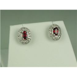 Superb 14 karat white gold ladies custom made  earrings set with two very fine blood red  rubies wei