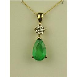Terrific 14 karat yellow gold ladies custom  made pendant set with a center fine green  pear shape e