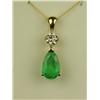 Image 1 : Terrific 14 karat yellow gold ladies custom  made pendant set with a center fine green  pear shape e