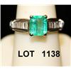 Image 1 : Ladies ring set showing 1.40ct emeralds and  12 baguette diamonds weighing .6ct, set in  14kt white 