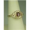 Image 2 : Vibrant 14 karat yellow gold ladies ring set  with a center red ruby weighing approx. 0.60  carats a