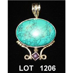 Sterling silver pendant showing turquoise and  amethyst cabochon. Est: $100-$150.