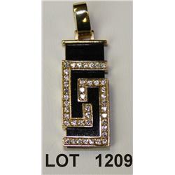 14kt modern designed pendant showing  rectangular black onyx. Est: $300 - $400