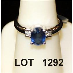 Ladies 18kt white gold ladies sapphire ring  set with 1.5ct oval blue sapphire and .2ct in  square d