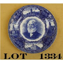 Flo blue souvenir plate showing Henry  Longfellow at center along with State of  Maine landmarks. Ma