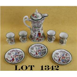 Set of Japanese ceremonial porcelain tea set  including a pot with cover, three small  plates and fo