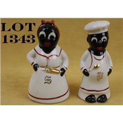 Collectible circa 1940s to 1960s hand painted  salt and pepper shakers of a black man  (pepper) and 