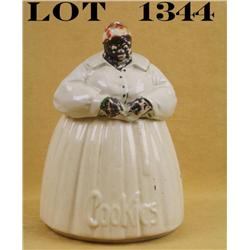 Older two-piece cookie jar signed “McCoy” on  the base; approx. 11” high and approx. 7” in  diameter