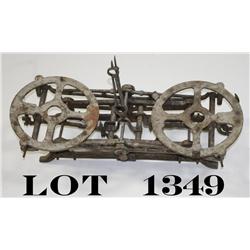 Large decorative iron balance scale 24”  overall and approx. 9” wide showing rustic  uncleaned condi