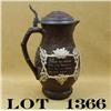 Image 1 : Large Mettlach pitcher/stein, approx. 13” in  height and approx. 6” in diameter in overall  very goo