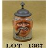 Image 1 : Older German-style stoneware stein approx. 6”  tall and with a pot metal lid with raised  face of an