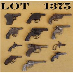 Lot of 12 old metal cap guns including two  Kilgores, an A Master, a bird’s head grip  “Army”, a Ste