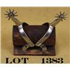Image 1 : Northern Judd Spurs with nickel finish.  Clearly marked with anchor, on a wood stand.  Est.: $60-$12