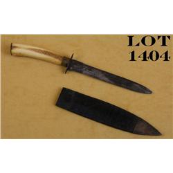 Bone gripped dirk with leather scabbard,  approx. 9-1/2” overall with an approx. 5-1/2”  blade in ov