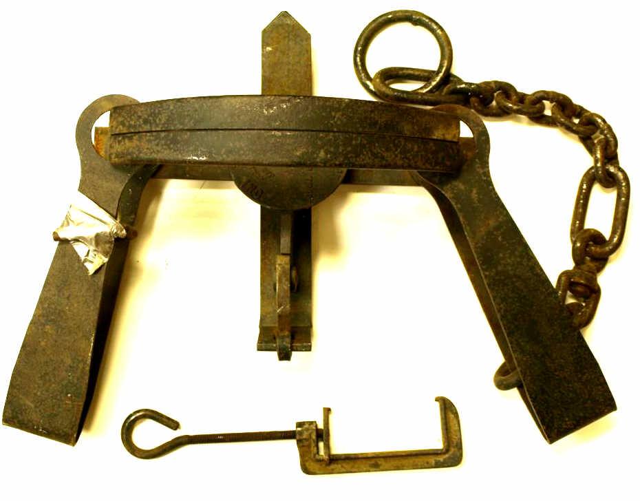 Large bear trap by Herters measures 40" W, the pan marked Herters Inc