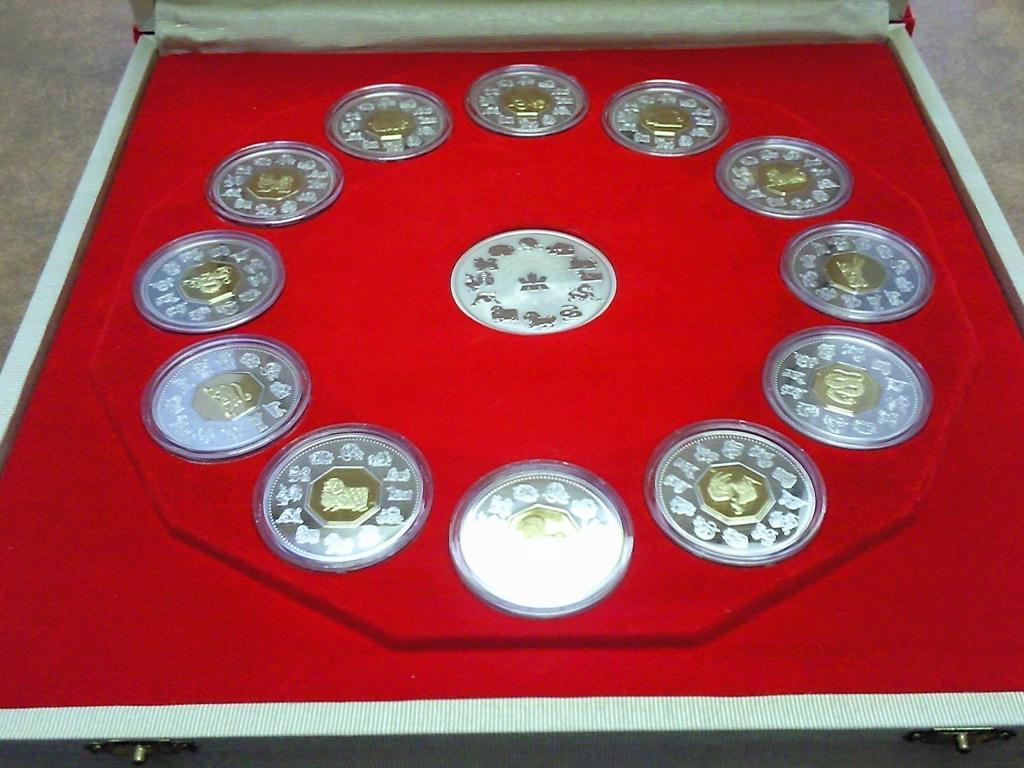 A COMPLETE 12 COIN SET OF CANADIAN 15 LUNAR COINS