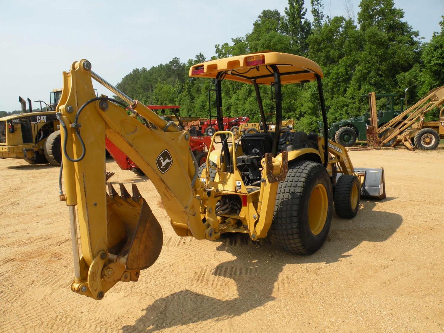 JOHN DEERE 110 4X4 LOADER BACKHOE J.M. Wood Auction Company, Inc.